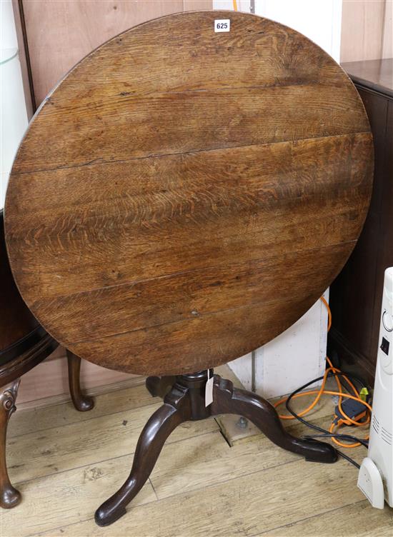 A George III oak tripod table, W.82cm